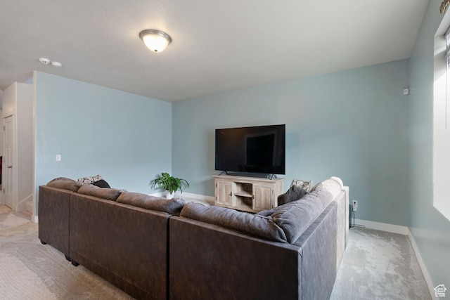living room with baseboards and light colored carpet