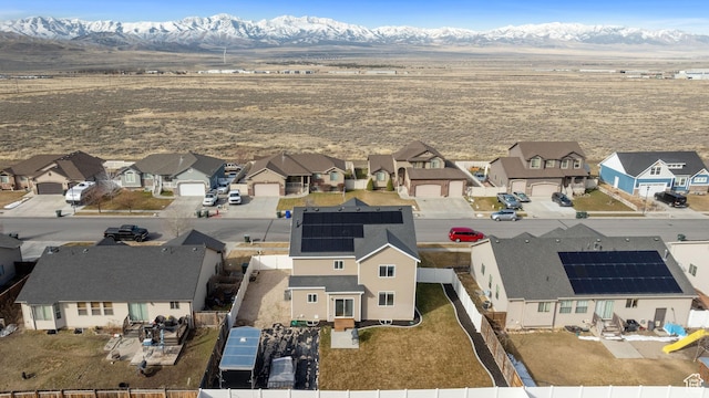 drone / aerial view featuring a residential view and a mountain view