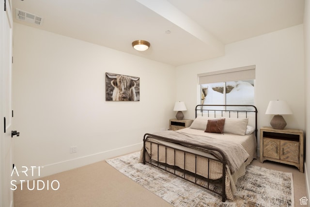 bedroom featuring carpet floors, visible vents, and baseboards