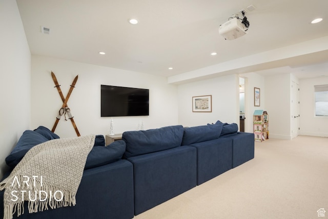 living area with light carpet, baseboards, visible vents, and recessed lighting