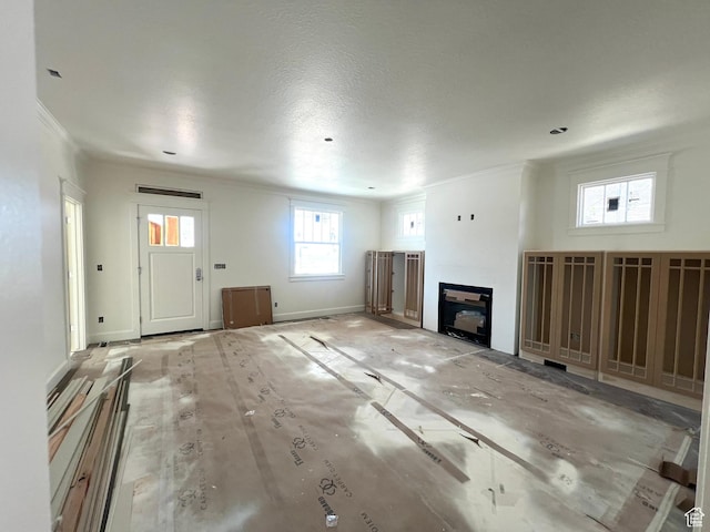 473 S Main St Unit 138, Vineyard, UT 84058 - unfurnished living room featuring crown molding and a glass covered fireplace