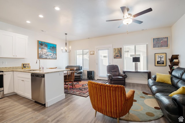 336 N 100 W, Morgan, UT 84050 - living room featuring recessed lighting, visible vents, light wood-style flooring, baseboards, and ceiling fan with notable chandelier