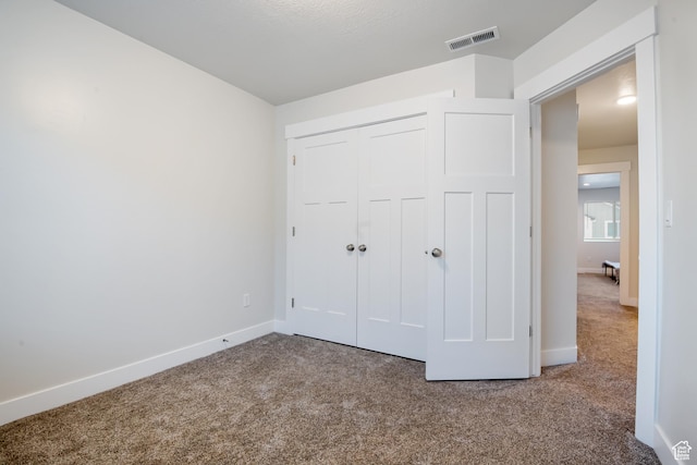 336 N 100 W, Morgan, UT 84050 - unfurnished bedroom with carpet, a closet, visible vents, and baseboards