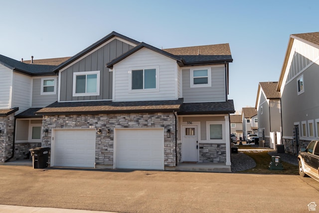 336 N 100 W, Morgan, UT 84050 - view of property featuring an attached garage, driveway, and board and batten siding