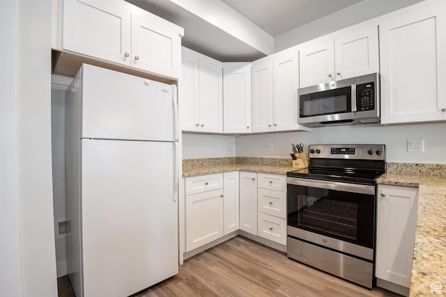 336 N 100 W, Morgan, UT 84050 - kitchen featuring stainless steel appliances, light stone countertops, white cabinets, and light wood-style floors