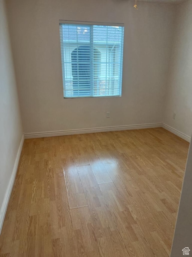 196 E Spencer Peak Way S Unit D9, Draper, UT 84020 - spare room with wood finished floors and baseboards