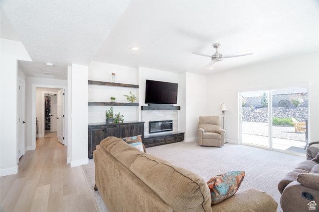 1044 E Southern Homestead Blvd, Enoch, UT 84721 - living room featuring ceiling fan, baseboards, and a glass covered fireplace