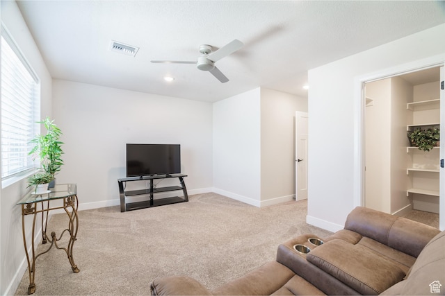 1044 E Southern Homestead Blvd, Enoch, UT 84721 - carpeted living area featuring ceiling fan, visible vents, and baseboards