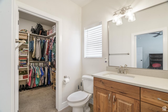 1044 E Southern Homestead Blvd, Enoch, UT 84721 - bathroom featuring toilet, a spacious closet, and vanity