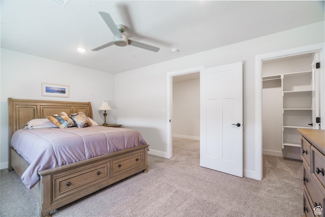 1044 E Southern Homestead Blvd, Enoch, UT 84721 - bedroom with a walk in closet, light carpet, ceiling fan, and baseboards