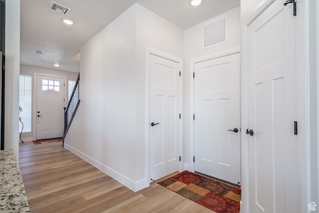 1044 E Southern Homestead Blvd, Enoch, UT 84721 - foyer entrance with light wood finished floors, baseboards, and visible vents
