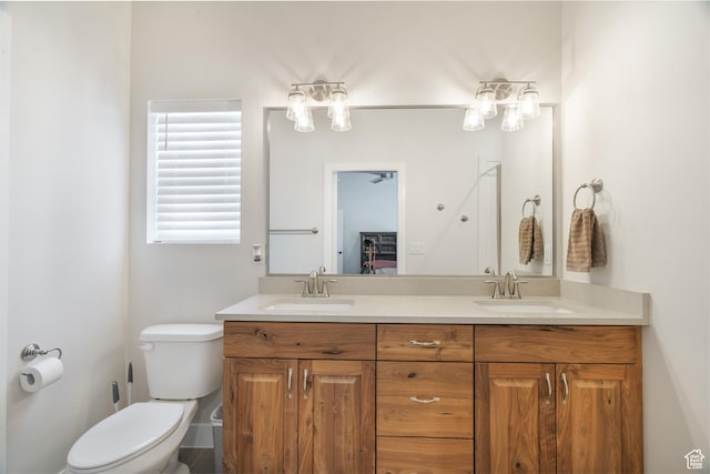 1044 E Southern Homestead Blvd, Enoch, UT 84721 - bathroom with double vanity, a sink, and toilet