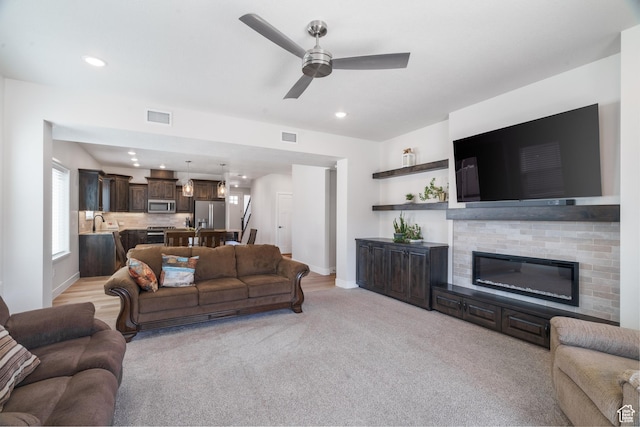 1044 E Southern Homestead Blvd, Enoch, UT 84721 - living room with ceiling fan, recessed lighting, visible vents, and light colored carpet