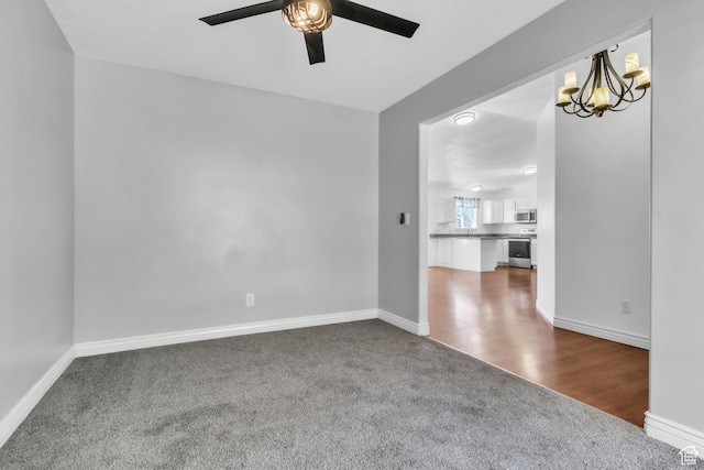2172 S Dakota Ave, Provo, UT 84606 - spare room featuring baseboards and dark colored carpet