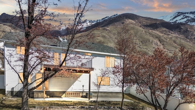 2172 S Dakota Ave, Provo, UT 84606 - exterior space featuring entry steps, a mountain view, a balcony, and a patio