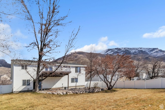 2172 S Dakota Ave, Provo, UT 84606 - back of house featuring a yard, fence, and a mountain view