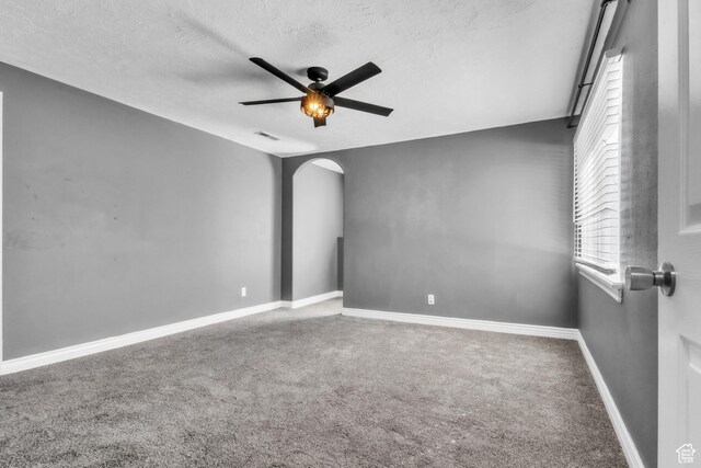 2172 S Dakota Ave, Provo, UT 84606 - carpeted spare room with a ceiling fan, arched walkways, a textured ceiling, and baseboards