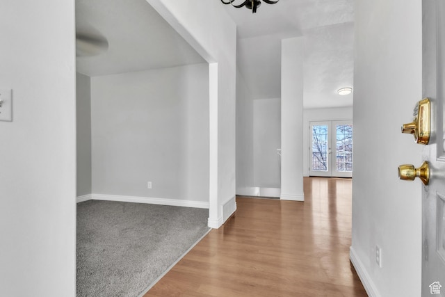 2172 S Dakota Ave, Provo, UT 84606 - entrance foyer featuring carpet floors, baseboards, wood finished floors, and french doors
