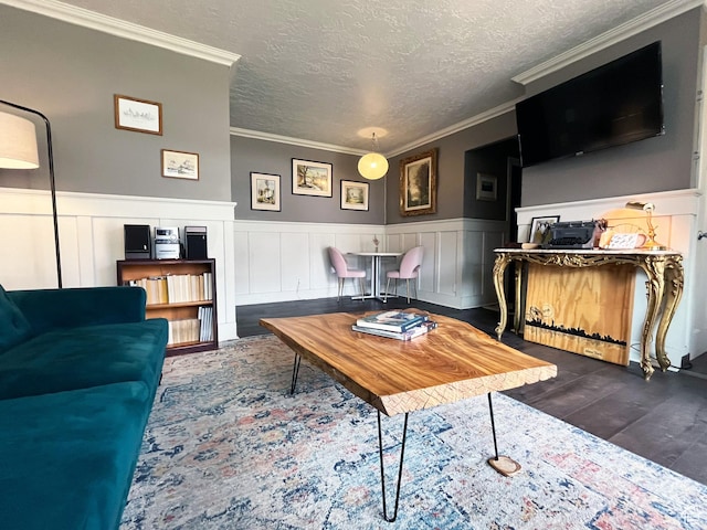 130 S 1300 E Unit 206, Salt Lake City, UT 84102 - living area featuring dark wood-style floors, a wainscoted wall, crown molding, a textured ceiling, and a decorative wall