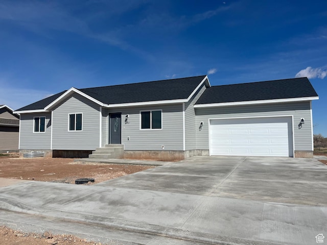 1943 S State St, Roosevelt, UT 84066 - ranch-style house with a garage, concrete driveway, and entry steps