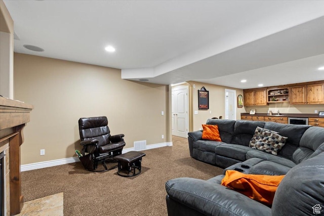 5009 W Greenstreak Dr, Riverton, UT 84096 - living area with a fireplace with flush hearth, visible vents, baseboards, and light colored carpet