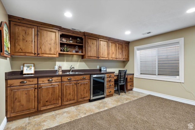 5009 W Greenstreak Dr, Riverton, UT 84096 - kitchen featuring wine cooler, visible vents, brown cabinetry, and a sink