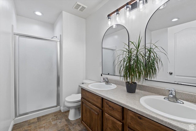 5009 W Greenstreak Dr, Riverton, UT 84096 - bathroom featuring a stall shower, visible vents, a sink, and toilet