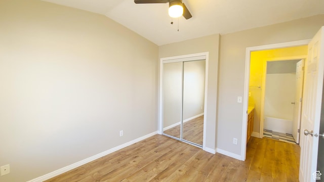 623 W Villa Bluff Dr, Sandy, UT 84070 - unfurnished bedroom featuring vaulted ceiling, a closet, ceiling fan, light wood finished floors, and baseboards