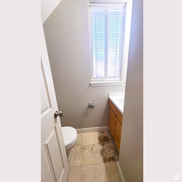 623 W Villa Bluff Dr, Sandy, UT 84070 - bathroom featuring baseboards, a wealth of natural light, vanity, and toilet