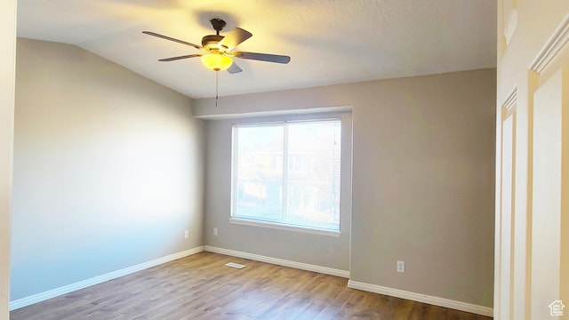 623 W Villa Bluff Dr, Sandy, UT 84070 - empty room with lofted ceiling, wood finished floors, a ceiling fan, and baseboards