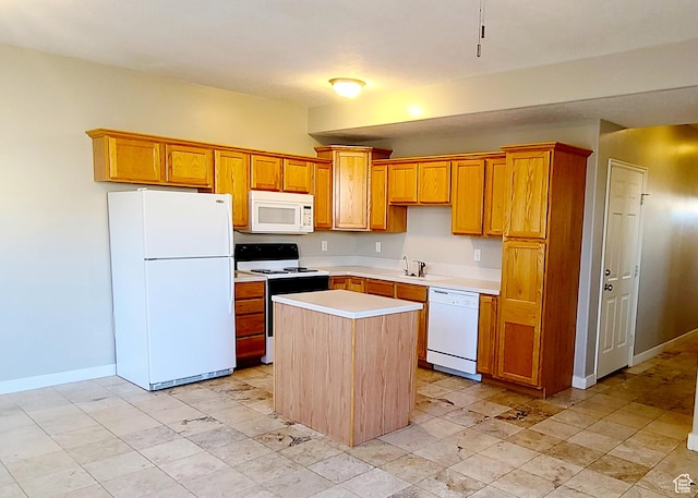 623 W Villa Bluff Dr, Sandy, UT 84070 - kitchen featuring light countertops, a sink, white appliances, a kitchen island, and baseboards