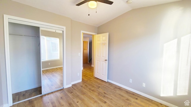 623 W Villa Bluff Dr, Sandy, UT 84070 - unfurnished bedroom with lofted ceiling, a closet, baseboards, and light wood-type flooring