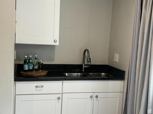 130 S 1300 E Unit 314, Salt Lake City, UT 84102 - kitchen with a sink, dark countertops, and white cabinetry