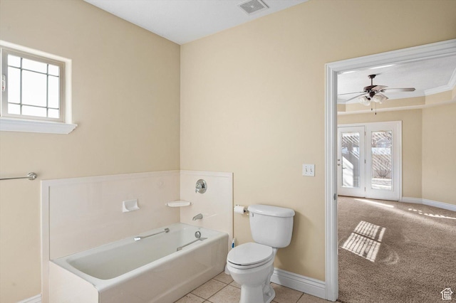 6802 S Triumph Ln, West Jordan, UT 84084 - bathroom featuring toilet, baseboards, visible vents, and a bath