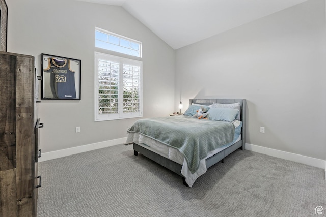 bedroom featuring vaulted ceiling, carpet flooring, and baseboards
