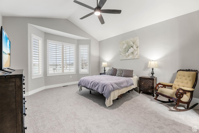 bedroom with carpet floors, lofted ceiling, ceiling fan, and baseboards