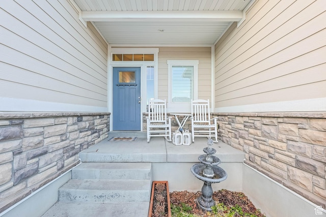 view of exterior entry with stone siding