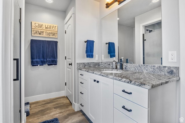 180 S Main St, Fayette, UT 84630 - full bath with recessed lighting, vanity, baseboards, and wood finished floors