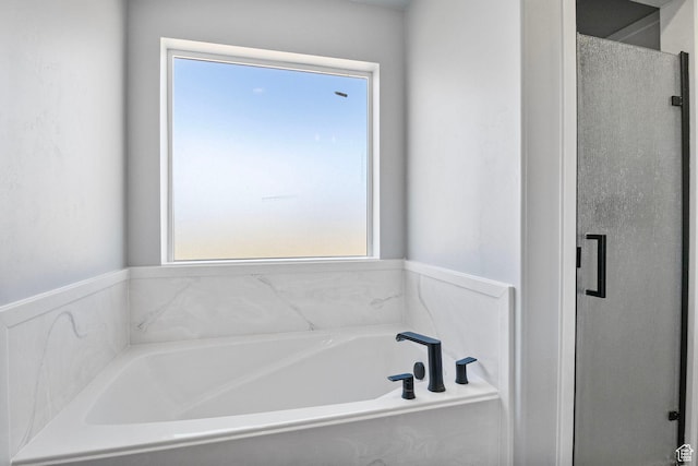 180 S Main St, Fayette, UT 84630 - full bathroom featuring a stall shower and a garden tub