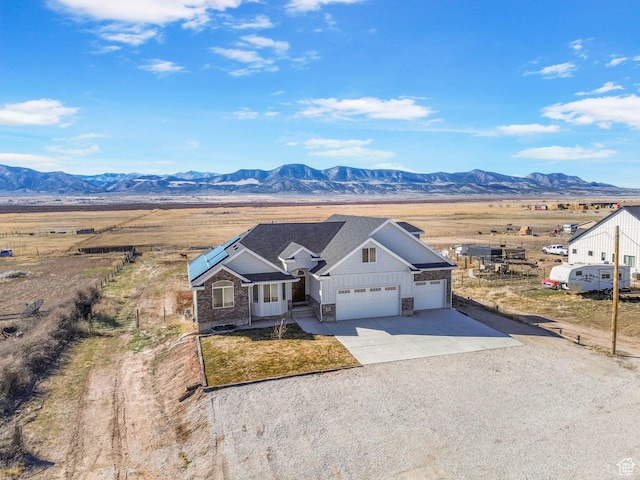 180 S Main St, Fayette, UT 84630 - view of front of home with driveway, fence, an attached garage, and a mountain view