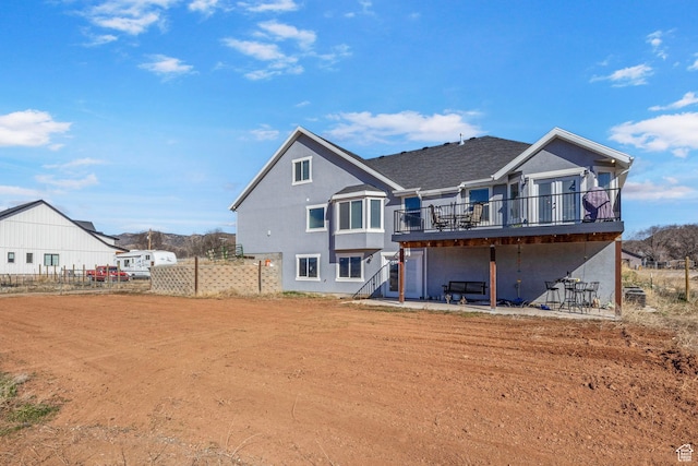 180 S Main St, Fayette, UT 84630 - back of property with stucco siding, a wooden deck, and fence