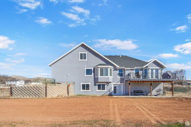 180 S Main St, Fayette, UT 84630 - rear view of house featuring stairway, fence, and a deck