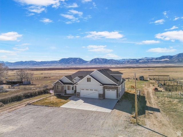 180 S Main St, Fayette, UT 84630 - view of front facade featuring a garage, fence, a mountain view, and a rural view