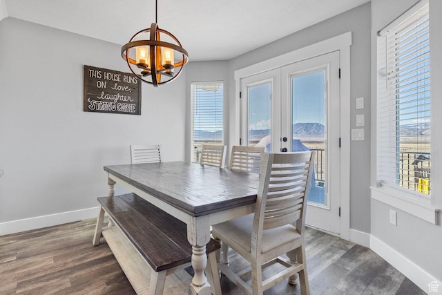180 S Main St, Fayette, UT 84630 - dining area with a notable chandelier, french doors, dark wood-style flooring, and baseboards