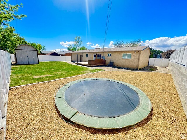 770 N 1000 E, Lehi, UT 84043 - rear view of property with a storage shed, a fenced backyard, central AC unit, a lawn, and an outdoor structure