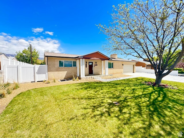 770 N 1000 E, Lehi, UT 84043 - single story home with driveway, a front yard, brick siding, fence, and an attached garage