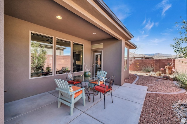 530 W Cougar Way, Ivins, UT 84738 - view of patio / terrace featuring a mountain view, fence, and outdoor dining space