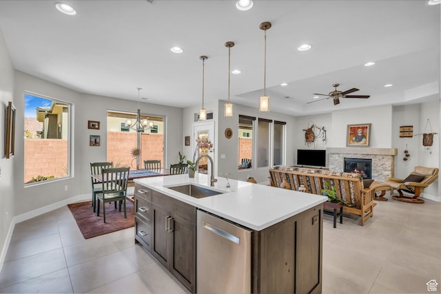 530 W Cougar Way, Ivins, UT 84738 - kitchen featuring light countertops, recessed lighting, a sink, dishwasher, and a glass covered fireplace
