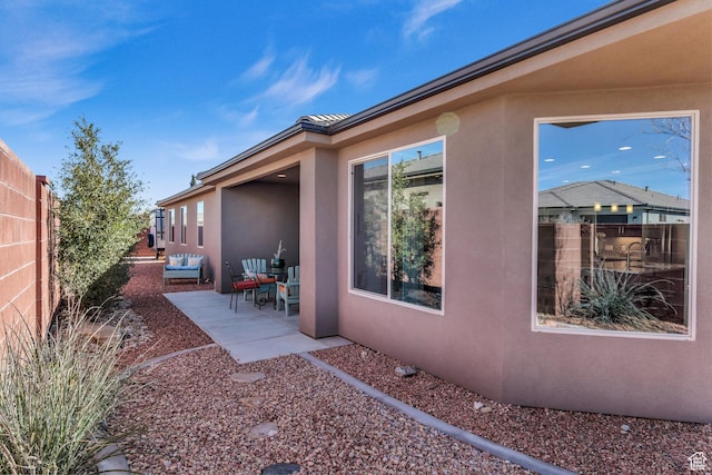 530 W Cougar Way, Ivins, UT 84738 - view of side of home with stucco siding, fence, and a patio area