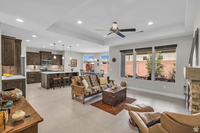 530 W Cougar Way, Ivins, UT 84738 - living room with recessed lighting, baseboards, a raised ceiling, visible vents, and a ceiling fan